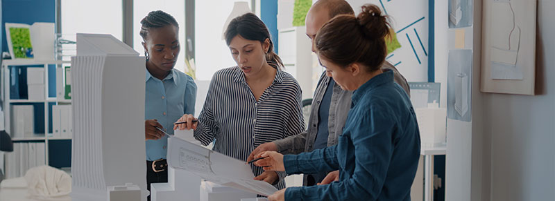 Permitask professionals reviewing commercial sign plans and organizing permit submittals in Florida